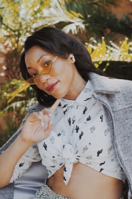 Model in yellow sunglasses and a cactus-print shirt