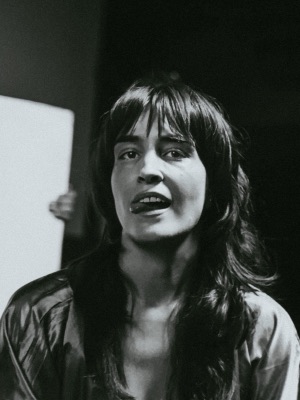 Black-and-white portrait in a satin robe